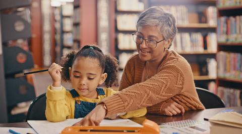 Tutor assisting a student with homework