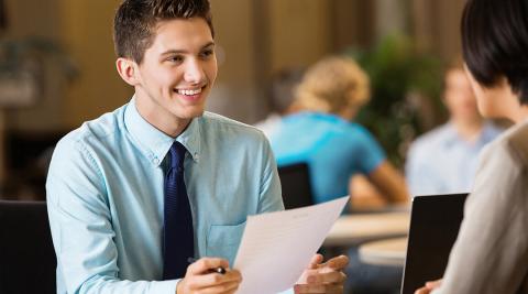 A young man interviewing for a job.